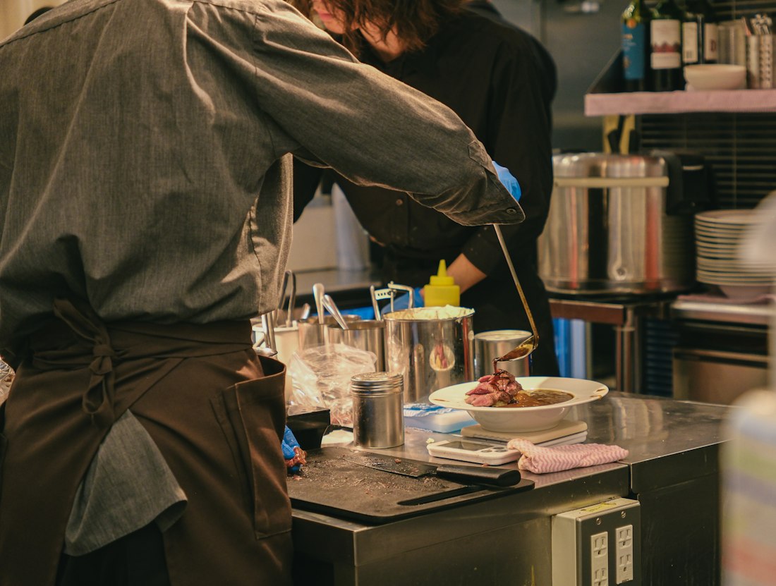 Restaurant chefs working together during service